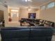 Inviting living room features a large sectional, arched details and front door at 1006 Tropical Dr, Bradenton, FL 34208