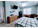 Spacious bedroom with a queen bed, work area, and ample storage space at 1006 Tropical E Dr, Bradenton, FL 34208