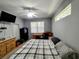 Bright bedroom with a queen size bed, workspace, and plenty of natural light at 1006 Tropical E Dr, Bradenton, FL 34208
