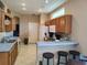 Well-lit kitchen with breakfast bar and ample countertop space at 1006 Tropical E Dr, Bradenton, FL 34208