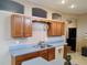 Well-lit kitchen featuring ample cabinet space and modern appliances at 1006 Tropical E Dr, Bradenton, FL 34208