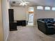 Comfortable living room area with a home office area near the leather sectional seating at 1006 Tropical E Dr, Bradenton, FL 34208