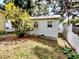 Exterior shot of the shed with painted white wood and an air conditioner on a well-kept lawn at 1006 Tropical E Dr, Bradenton, FL 34208