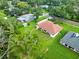 Aerial view showcases the home's well-maintained lawn, landscaping, and peaceful neighborhood setting at 1015 Hastings Ct, Lutz, FL 33548