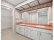 Bathroom with double sink vanity, large mirror, and access to the closet at 1015 Hastings Ct, Lutz, FL 33548