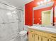 Contemporary bathroom with a glass-enclosed shower, toilet, and sink vanity at 1015 Hastings Ct, Lutz, FL 33548