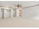 Large bedroom with carpet, ceiling fan, and closet view at 1015 Hastings Ct, Lutz, FL 33548