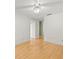 Bedroom with hardwood floors, ceiling fan, and a neutral wall color at 1015 Hastings Ct, Lutz, FL 33548