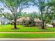 Charming single-story home with a well-manicured lawn and mature trees in a desirable neighborhood at 1015 Hastings Ct, Lutz, FL 33548