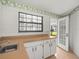 Bright kitchen features a stainless steel sink, window, and access to the outdoor area at 1015 Hastings Ct, Lutz, FL 33548