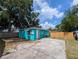 A spacious backyard with a concrete patio and a fenced perimeter for privacy and security at 1028 E 93Rd Ave # A, Tampa, FL 33612