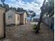 Backyard with mature tree offering shade, an outdoor patio, and yard at 1028 E 93Rd Ave # A, Tampa, FL 33612