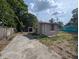 Outside shot of the exterior featuring a patio and yard at 1028 E 93Rd Ave # A, Tampa, FL 33612