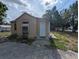 Exterior view of the property featuring the home's facade and surrounding yard space at 1028 E 93Rd Ave # A, Tampa, FL 33612