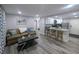 Inviting living room open to the kitchen features modern flooring and ample space for entertaining at 1028 E 93Rd Ave # A, Tampa, FL 33612