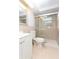Updated bathroom featuring a glass-enclosed shower, modern fixtures, and neutral color scheme at 1131 Dartmouth Dr, Holiday, FL 34691