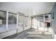 Enclosed patio area with screens, a concrete floor, and access to the backyard at 1131 Dartmouth Dr, Holiday, FL 34691