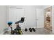 Bedroom set up as a gym with exercise equipment and plush gray carpeting at 12004 Cinnamon Fern Dr, Riverview, FL 33579