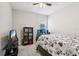 Bright bedroom with a ceiling fan, large window, and neutral paint for a serene space at 12004 Cinnamon Fern Dr, Riverview, FL 33579