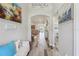 Inviting entryway with wood-look tile flooring leading to a spacious living area with comfortable seating at 12004 Cinnamon Fern Dr, Riverview, FL 33579