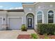 Charming front entrance with a blue glass door, brick pavers and a welcoming atmosphere at 12004 Cinnamon Fern Dr, Riverview, FL 33579