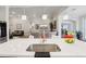 Bright, open kitchen with modern appliances, large island, and seamless flow to living area at 12004 Cinnamon Fern Dr, Riverview, FL 33579