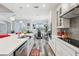 Spacious kitchen with center island, modern appliances, and adjacent dining area at 12004 Cinnamon Fern Dr, Riverview, FL 33579