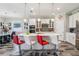 Bright kitchen boasts white cabinets, stainless appliances, and a center island with seating at 12004 Cinnamon Fern Dr, Riverview, FL 33579