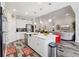Open-concept kitchen with large island, stainless steel appliances, and seamless flow to living area at 12004 Cinnamon Fern Dr, Riverview, FL 33579
