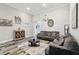 Well-decorated living room featuring tile floors, neutral-colored walls, and comfortable seating arrangements at 12004 Cinnamon Fern Dr, Riverview, FL 33579