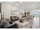 Large living area featuring tile floors, neutral walls, and comfortable sofas for a relaxing space at 12004 Cinnamon Fern Dr, Riverview, FL 33579