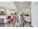 Open-concept layout connecting a kitchen with white cabinets and stainless steel appliances to a cozy living room at 12004 Cinnamon Fern Dr, Riverview, FL 33579