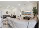 Open-concept living space with tile floors and an open layout to other living areas in the home at 12004 Cinnamon Fern Dr, Riverview, FL 33579