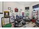 Home office features a large desk, comfortable seating, and stylish decor at 12004 Cinnamon Fern Dr, Riverview, FL 33579