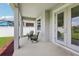 Covered patio with seating area, offering a relaxing outdoor space with view of backyard at 12004 Cinnamon Fern Dr, Riverview, FL 33579
