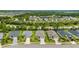 Aerial view of homes in a suburban neighborhood with mature trees and landscaping at 12739 Rainwashed Loop, Parrish, FL 34219
