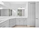 Bright bathroom featuring double vanity with modern fixtures and ample counter space at 12739 Rainwashed Loop, Parrish, FL 34219