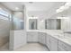 Bathroom featuring a glass shower and double vanity with modern fixtures and ample counter space at 12739 Rainwashed Loop, Parrish, FL 34219