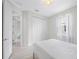 Bright bedroom featuring a modern light fixture, large closet and neutral walls at 12739 Rainwashed Loop, Parrish, FL 34219