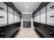 A walk-in closet with custom shelving and drawers for optimized storage at 12739 Rainwashed Loop, Parrish, FL 34219
