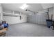 Spacious two car garage featuring bright lighting and epoxy flooring at 12739 Rainwashed Loop, Parrish, FL 34219