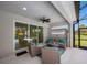 Covered patio featuring outdoor furniture and views of the pool and backyard at 12739 Rainwashed Loop, Parrish, FL 34219