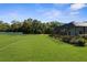 Huge backyard with covered pool area and large grassy space at 1280 Hill Flower Dr, Brooksville, FL 34604