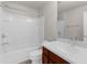 Bathroom featuring a tub, a shower, white tiling, and a vanity with dark wood cabinets at 1280 Hill Flower Dr, Brooksville, FL 34604