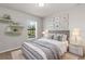 Stylish bedroom with neutral decor and ample natural light offers a serene retreat at 1280 Hill Flower Dr, Brooksville, FL 34604