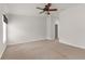 This light-filled bedroom features neutral colors and a walk-in closet at 1280 Hill Flower Dr, Brooksville, FL 34604