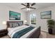 Cozy bedroom featuring a ceiling fan, natural light, and neutral paint at 1280 Hill Flower Dr, Brooksville, FL 34604