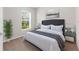 Tastefully decorated bedroom with soothing colors, large window, and stylish furnishings at 1280 Hill Flower Dr, Brooksville, FL 34604