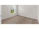 Neutral bedroom with a window view and carpet at 1280 Hill Flower Dr, Brooksville, FL 34604