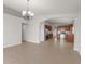 Dining area showcasing tile floors, an archway to kitchen with stainless steel appliances and wood cabinetry at 1280 Hill Flower Dr, Brooksville, FL 34604